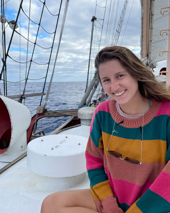 Sophia sitting on a sail boat